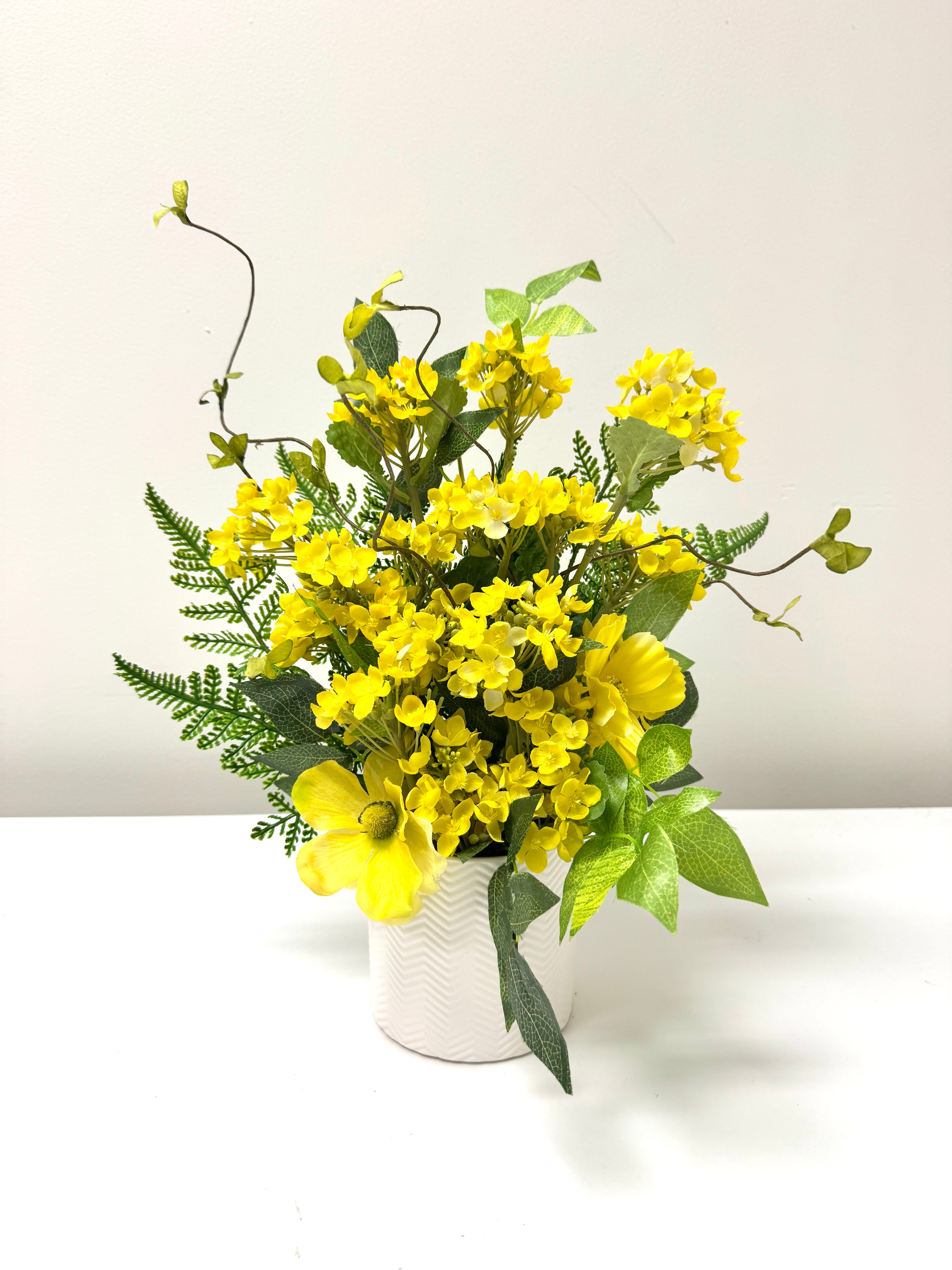 Yellow Alyssum Floral Bouquet in White Zig Zag Pot