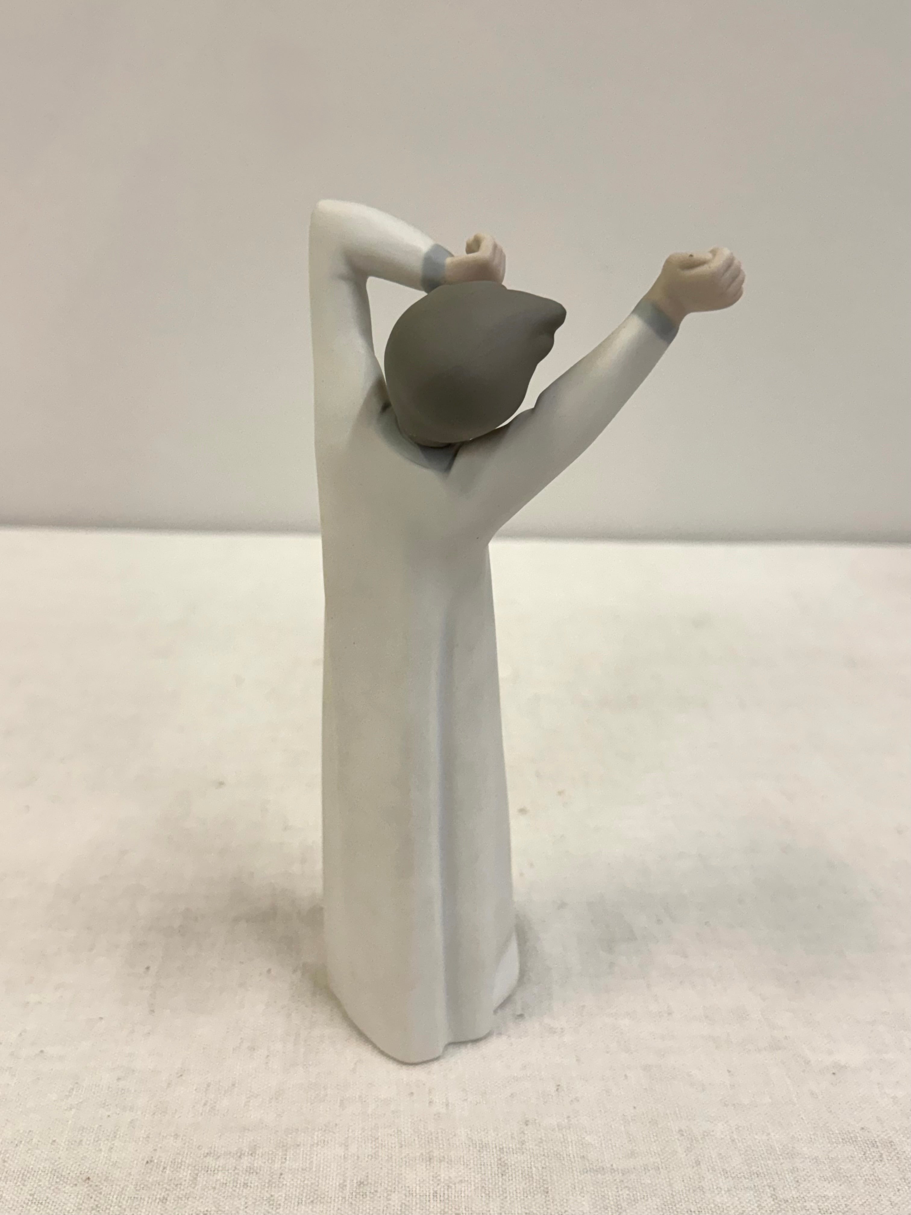 LLADRO 'Boy Yawning' Figurine